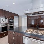 kitchen with dark brown custom cabinets